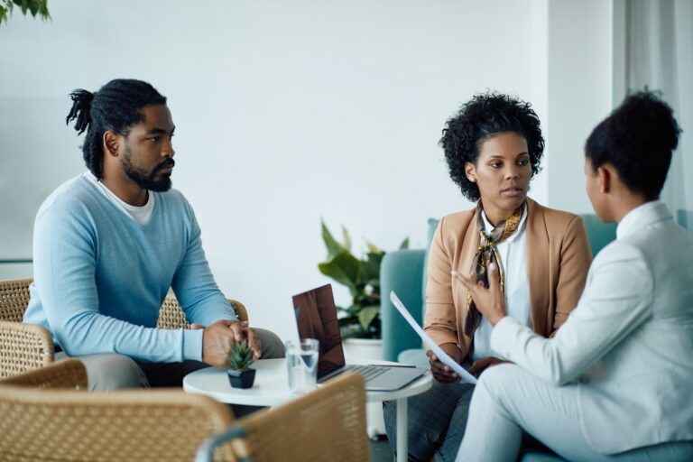 A confidential discussion between a client and a professional about Will Writing Services Wiltshire in a private office setting